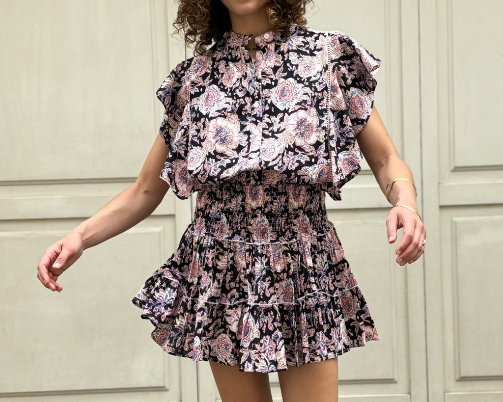 Jupe Poupette fond noir imprimée fleur rose